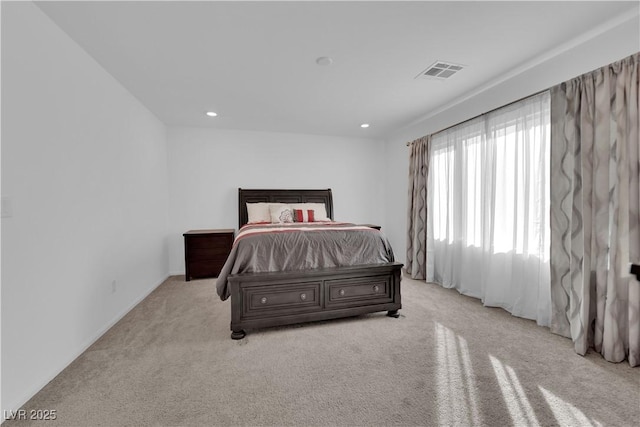 bedroom featuring light colored carpet