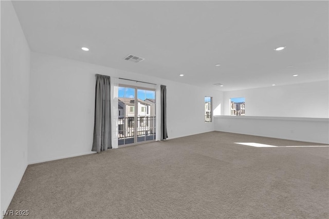 unfurnished room with carpet flooring