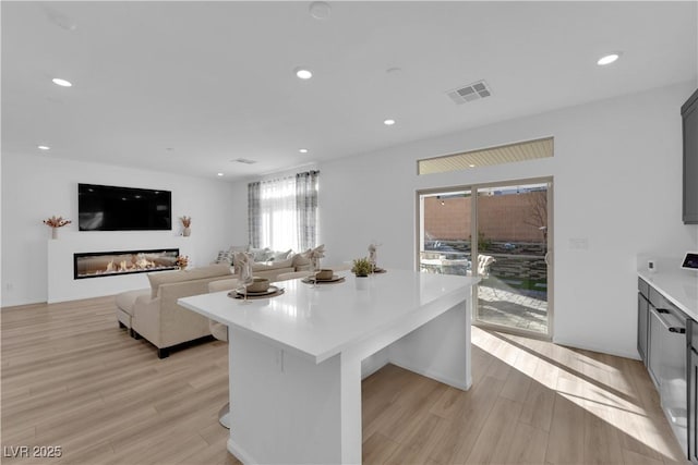 kitchen featuring a center island and light wood-type flooring