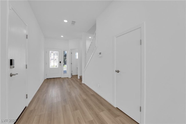 entryway with light hardwood / wood-style floors