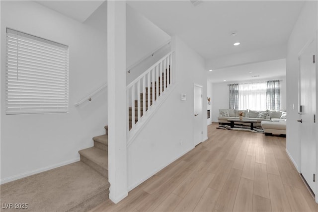 staircase featuring hardwood / wood-style floors