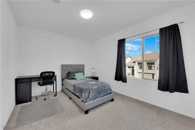 bedroom featuring light colored carpet