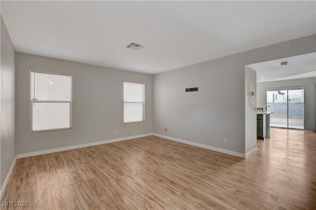 unfurnished room featuring light wood-type flooring