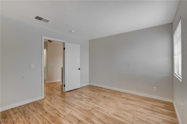 unfurnished room featuring light hardwood / wood-style flooring