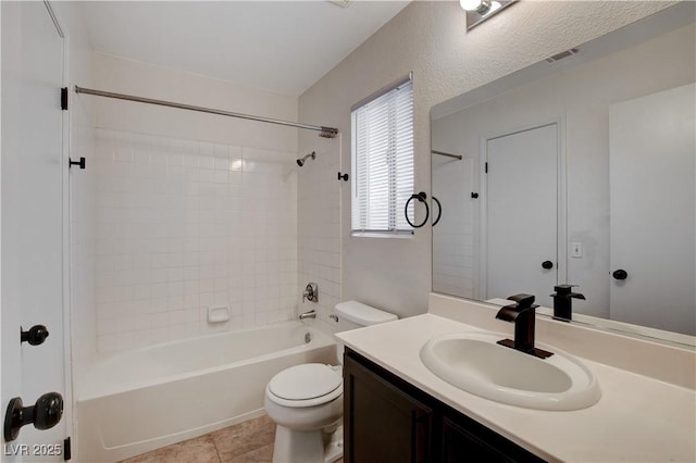 full bathroom featuring vanity, tile patterned flooring,  shower combination, and toilet