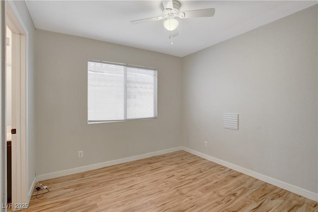 unfurnished room featuring ceiling fan and light wood-type flooring