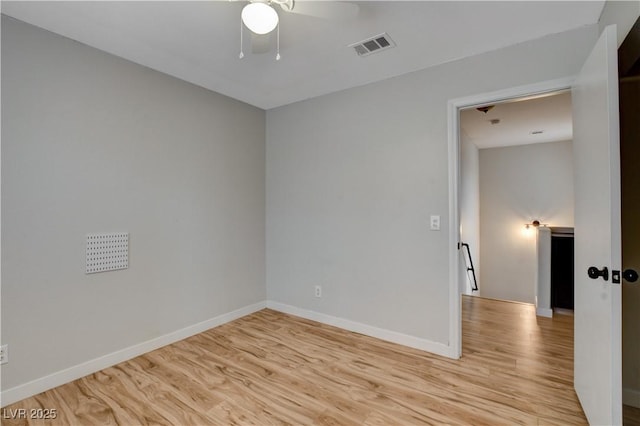 unfurnished room with ceiling fan and light wood-type flooring