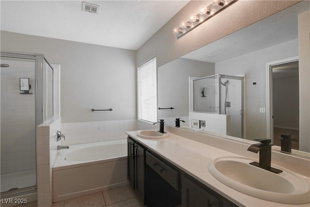 bathroom featuring vanity, tile patterned floors, and shower with separate bathtub