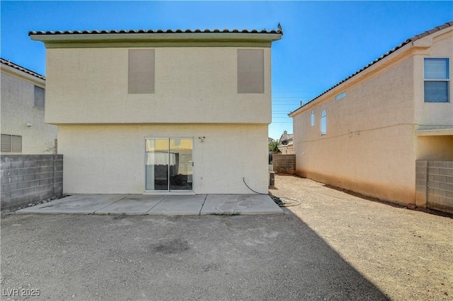 rear view of house featuring a patio area