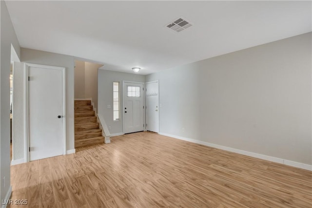 entrance foyer with light hardwood / wood-style flooring