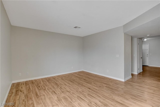 spare room with light wood-type flooring