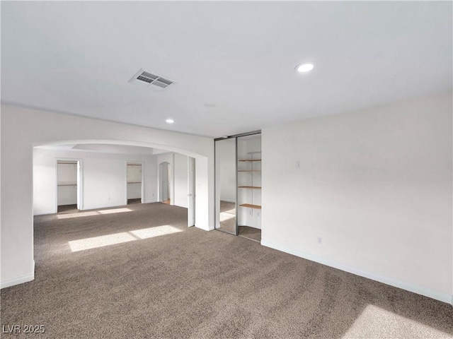 unfurnished room featuring carpet