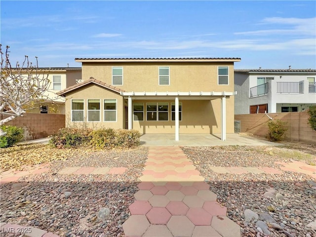 back of house featuring a patio