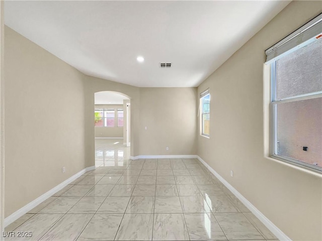 spare room with plenty of natural light