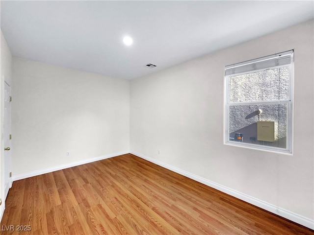 empty room featuring wood-type flooring