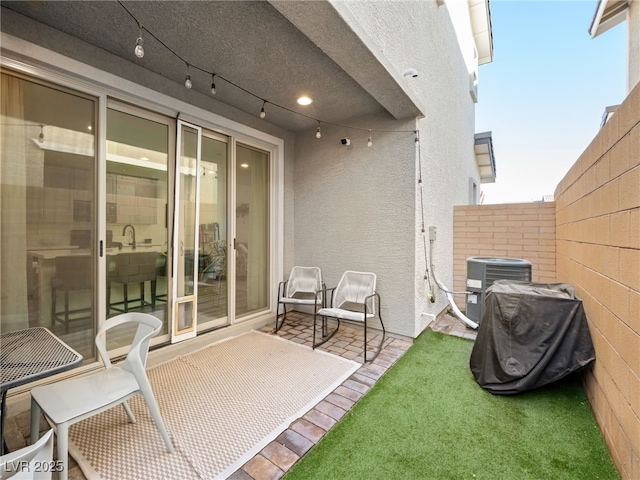 view of patio featuring central air condition unit