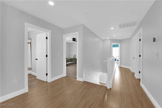 hallway with wood-type flooring