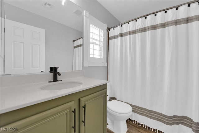 bathroom with vanity and toilet