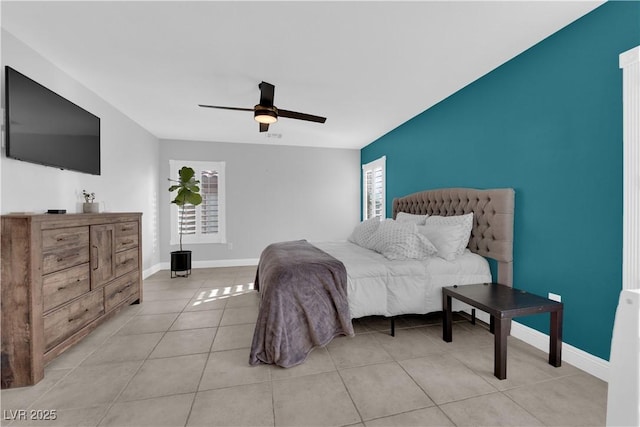 bedroom with light tile patterned flooring and ceiling fan