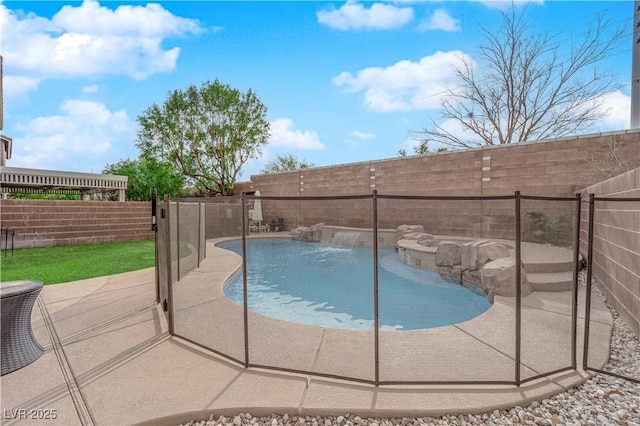 view of swimming pool with pool water feature and a patio