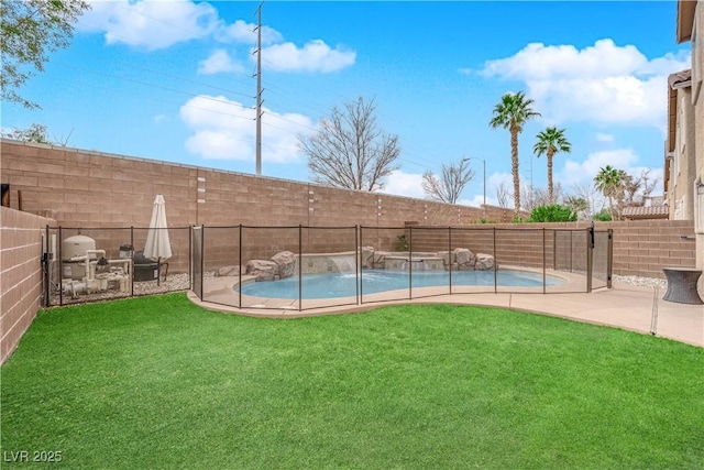 view of swimming pool with a yard, a patio area, and pool water feature