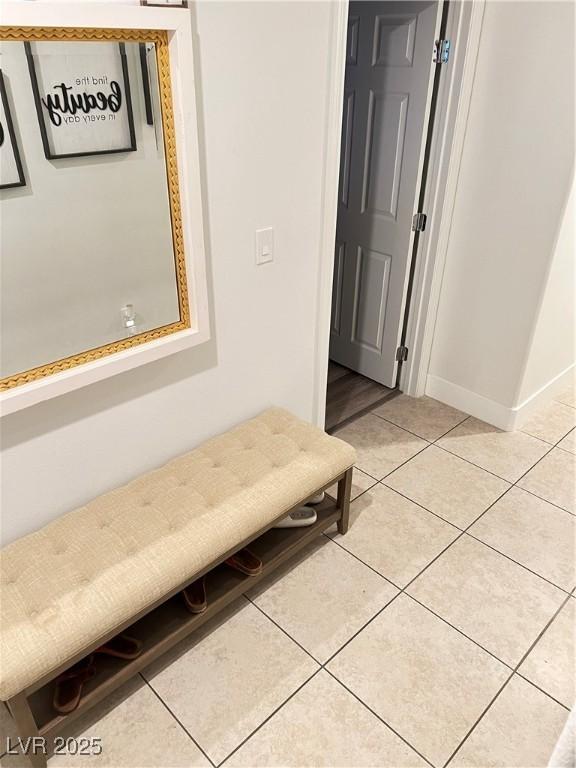 hallway featuring light tile patterned floors