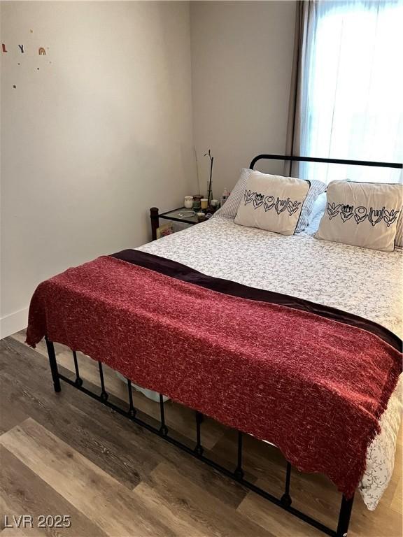 bedroom with wood-type flooring