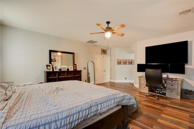 bedroom featuring dark hardwood / wood-style floors and ceiling fan