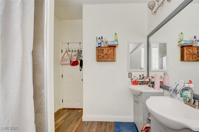 bathroom featuring wood-type flooring and vanity