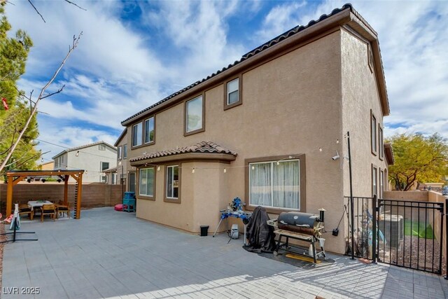 back of property featuring a patio area