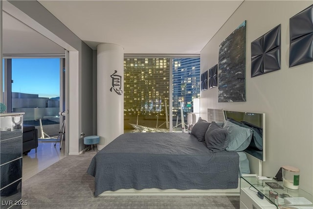 carpeted bedroom featuring multiple windows