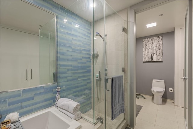 bathroom with independent shower and bath, tile patterned flooring, and toilet