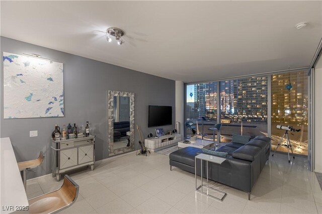 tiled living room featuring expansive windows