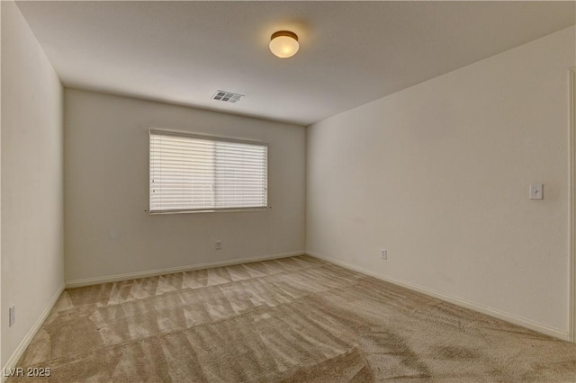 empty room featuring light carpet