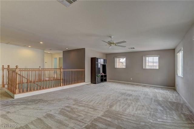 empty room with light carpet and ceiling fan