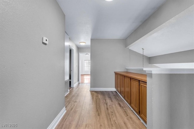 hall featuring light wood-type flooring