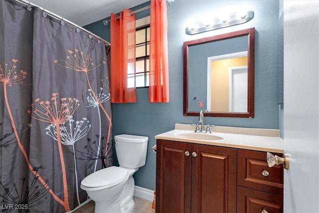 bathroom featuring vanity, curtained shower, tile patterned floors, and toilet