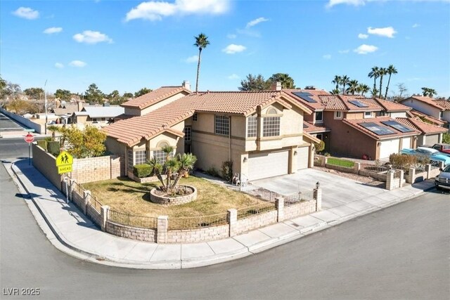 view of front of home with a garage and solar panels