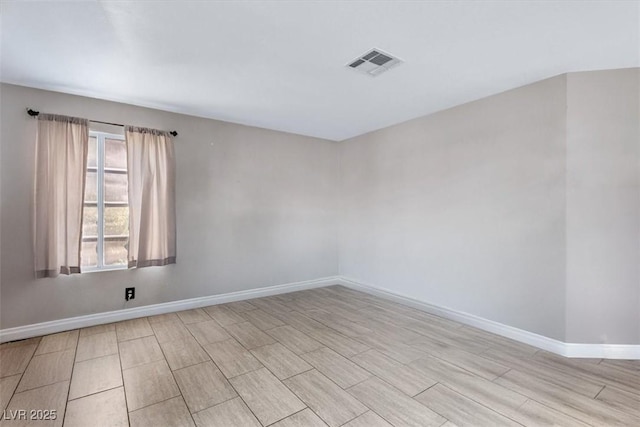 spare room featuring light wood-type flooring