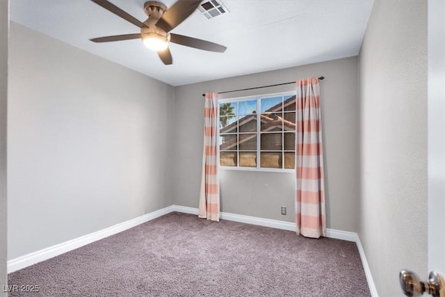 empty room with ceiling fan and carpet flooring