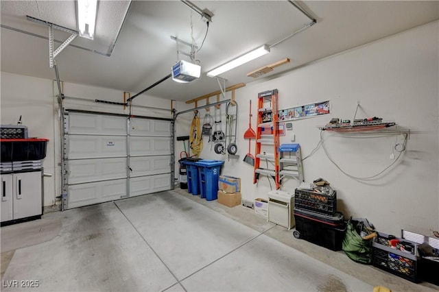 garage featuring a garage door opener