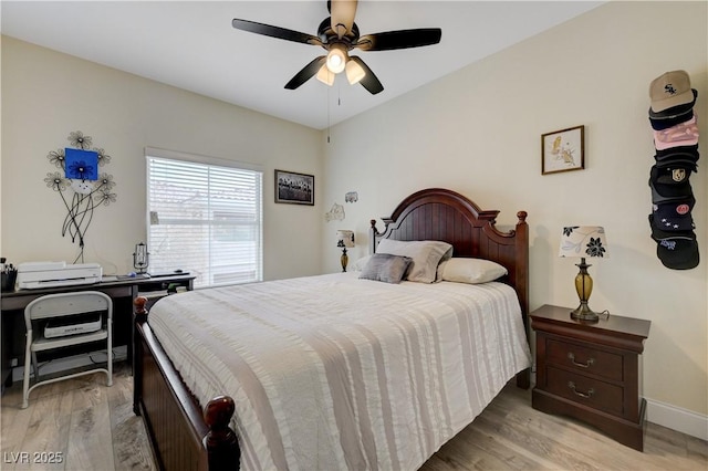 bedroom with ceiling fan and light wood-type flooring