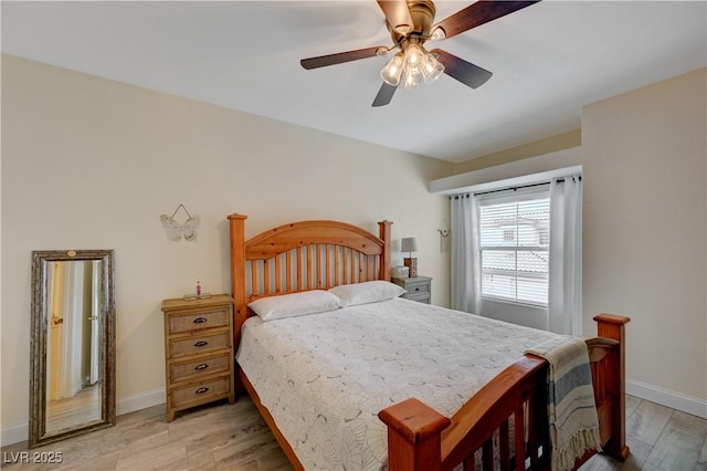 bedroom with ceiling fan and light hardwood / wood-style floors