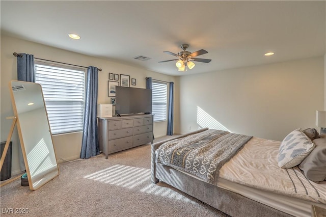 bedroom featuring recessed lighting, visible vents, light colored carpet, and ceiling fan