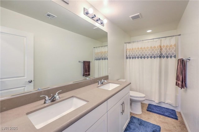 bathroom featuring walk in shower, vanity, toilet, and tile patterned flooring