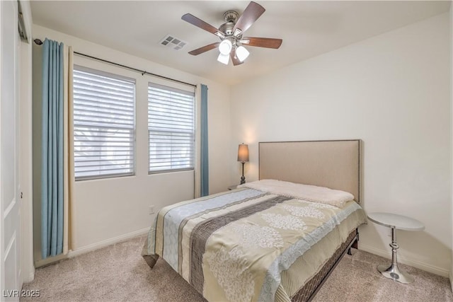 bedroom featuring visible vents, carpet flooring, baseboards, and ceiling fan