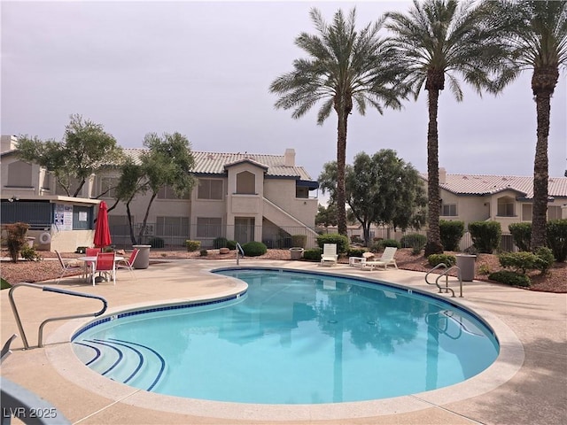 view of swimming pool with a patio