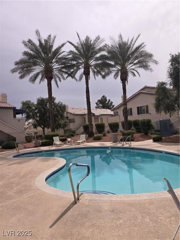 view of swimming pool with a patio area