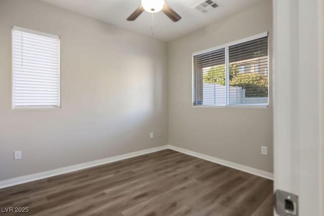 unfurnished room featuring dark hardwood / wood-style floors and ceiling fan