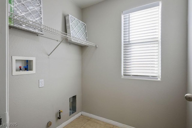 laundry area featuring gas dryer hookup, light tile patterned floors, and hookup for a washing machine